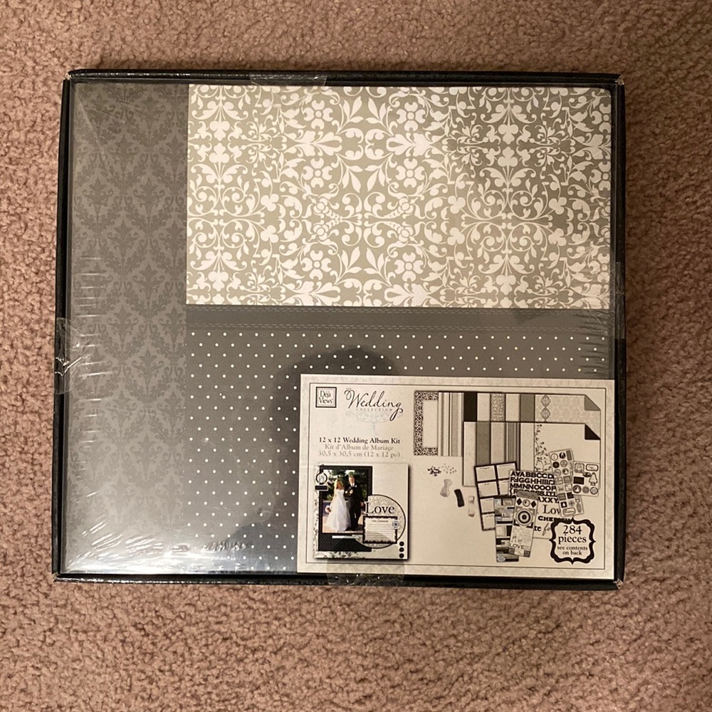 Never been opened wedding album kit!